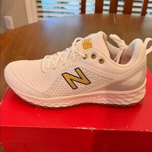 New Balance White Velo 2 White and Gold Women’s softball turf shoes